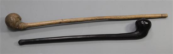 Two hardwood war clubs, one in a dark wood with a pointed knob, 58cm, the other bleached burr wood, 71cm